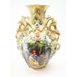 A large Continental vase, of ovoid form with naturalistic modelled twin gilt handles, decorated with