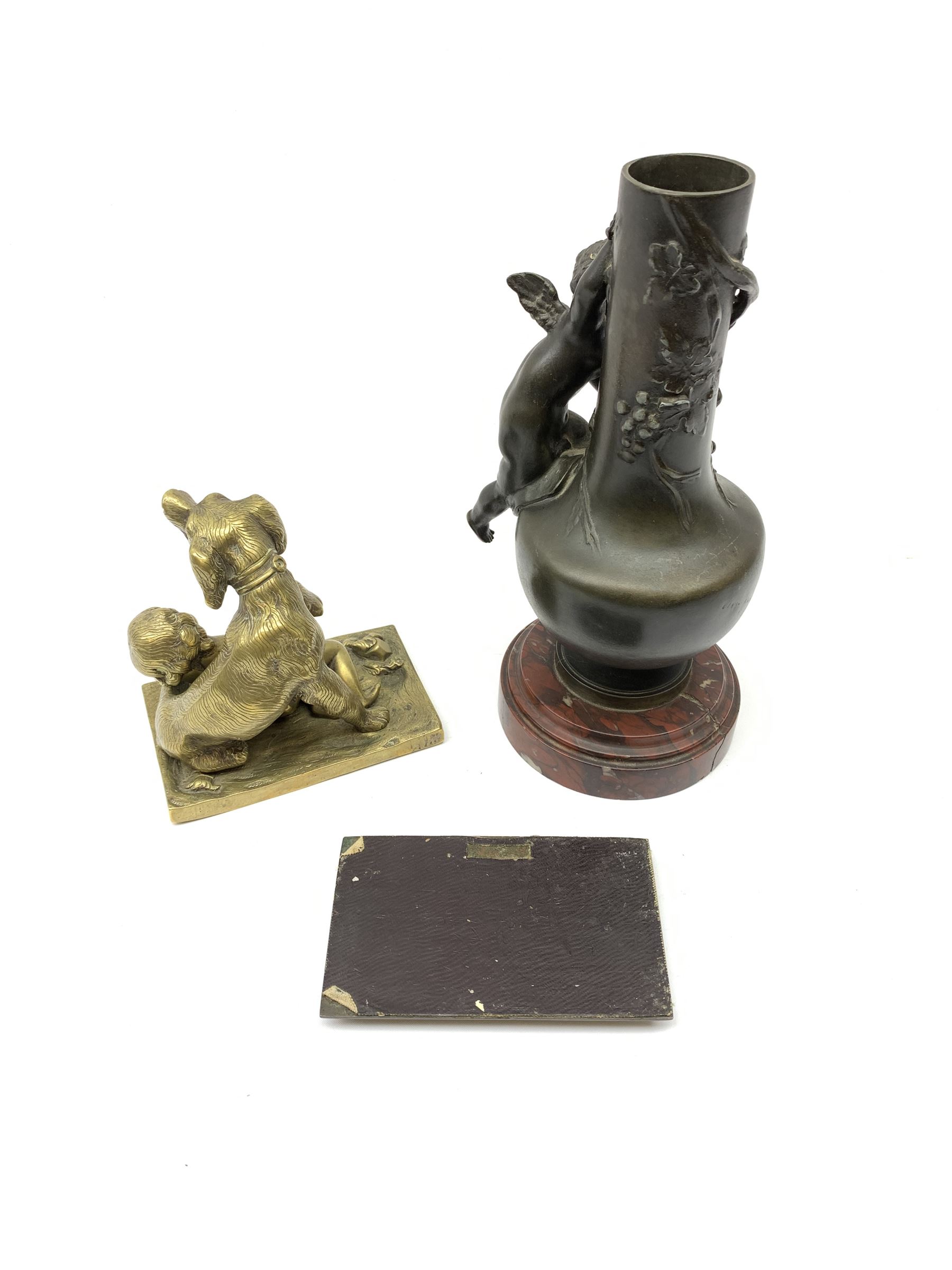 A bronzed spelter vase detailed with a fruiting vine and mounted with a cherub - Image 2 of 2