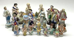 A collection of Continental porcelain pin cushion dolls