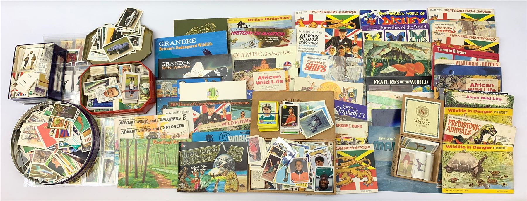 A collection of trade cards and reproduction cigarette cards