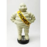 A cast iron Michelin man type figure
