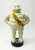 A cast iron Michelin man type figure