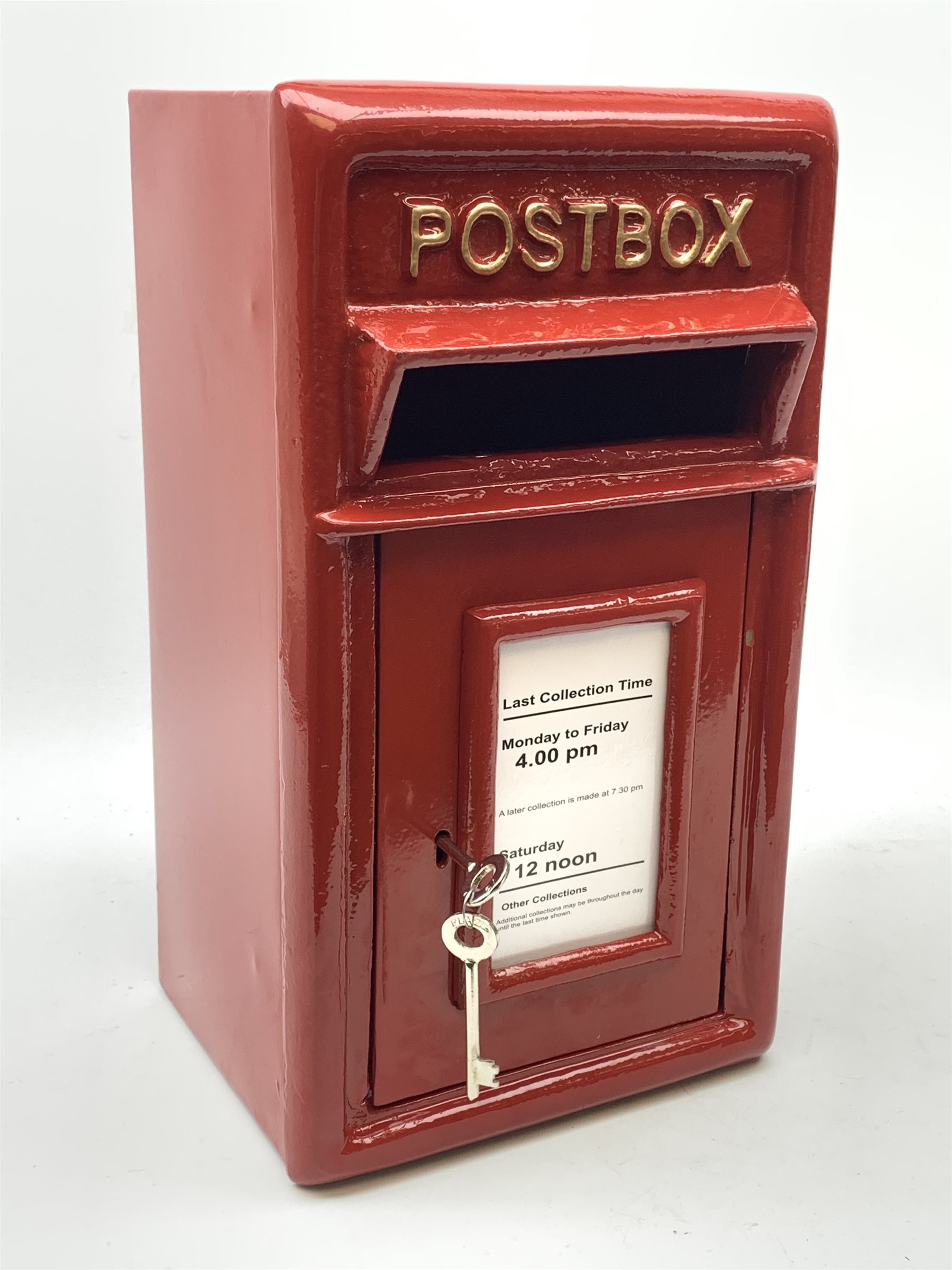 A reproduction red painted cast iron Postbox