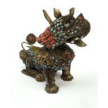 A 20th century Chinese filigree brass model of a Foo Dog