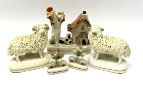 A pair of 19th century Staffordshire figures modelled as Sheep