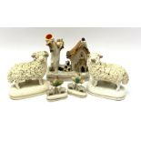 A pair of 19th century Staffordshire figures modelled as Sheep