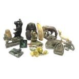 Inuit carved soapstone group of a figure hunting a Seal