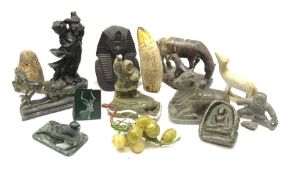 Inuit carved soapstone group of a figure hunting a Seal