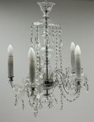 A glass chandelier, with five curved branches with drip pans and droppers, approximately H69cm.