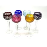 A set of five harlequin overlaid and cut hock glasses