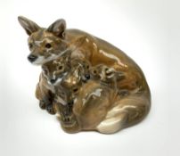 A Royal Copenhagen figure group modelled as a fox with cubs