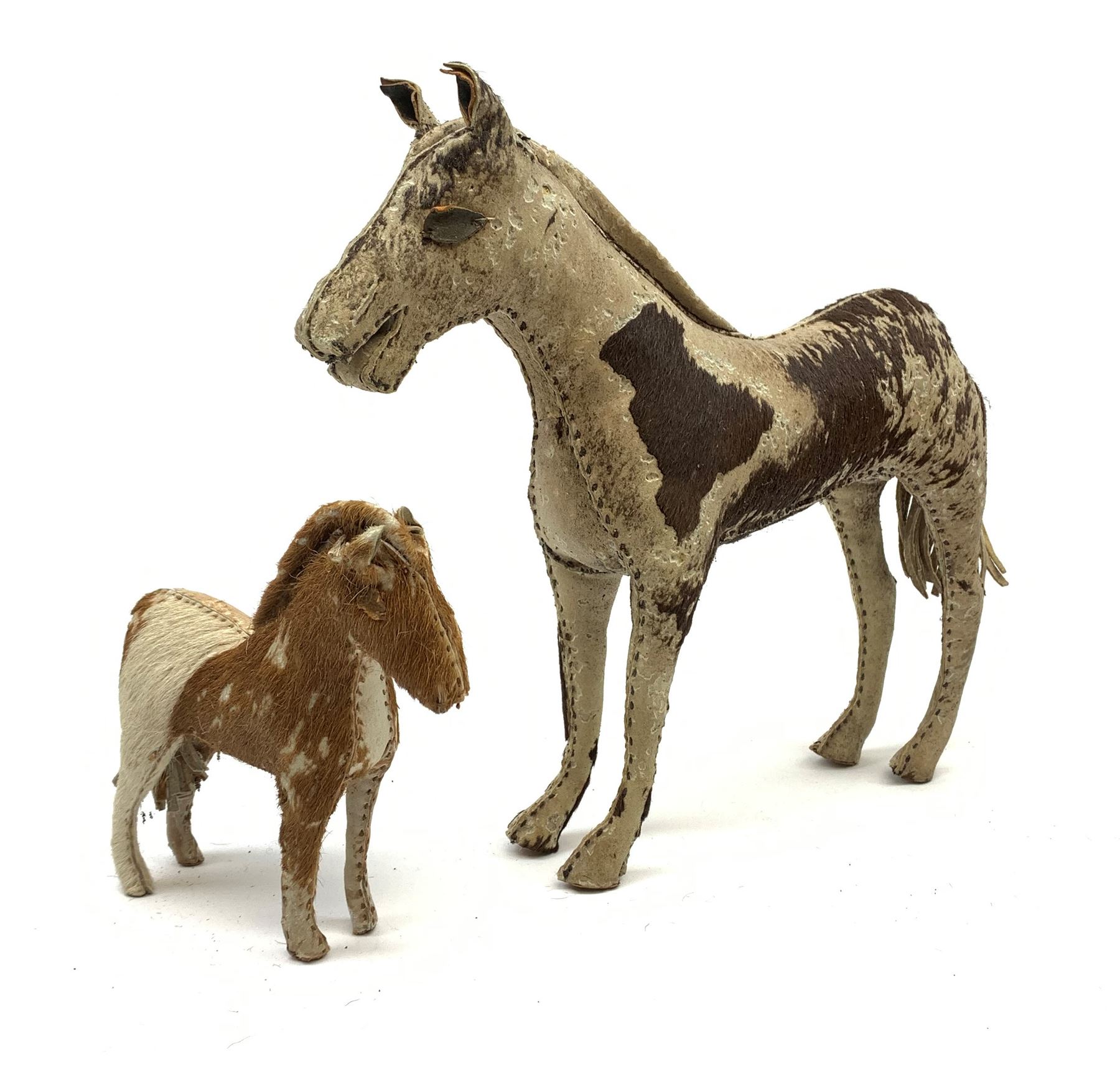 Two Edith Reynolds hand-made and rubber filled real skin horses