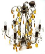 A Murano style chandelier, with six curved branches with frilled clear glass drip pans hung with cle