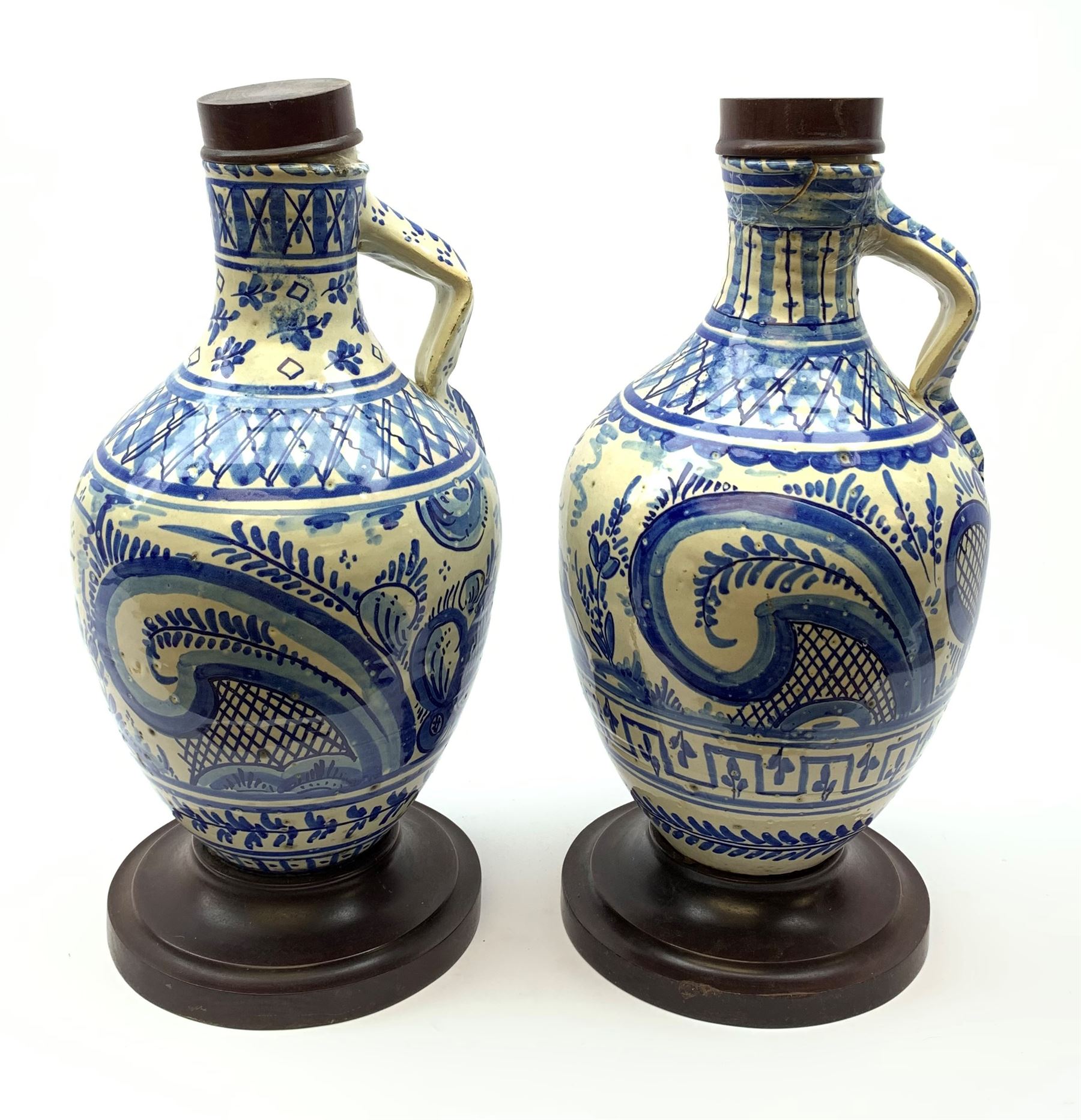 A pair of 20th century blue and white delft water jugs