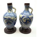 A pair of 20th century blue and white delft water jugs