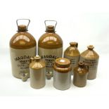 A group of stoneware bottles