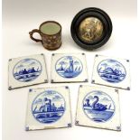 Five 19th century blue and white Delft tiles