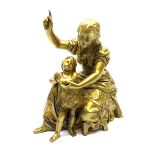 A gilt bronze figure of a mother and child