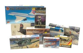 Nine assorted plastic model kits by various makers including Airfix 1/144th scale Concorde