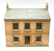 Victorian pine doll's house of double fronted two-storey form with brick painted facade and chimney