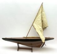 Pond yacht with part black painted mahogany hull and keel