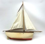Schooner style pond yacht with cream and red painted wooden hull with lead weighted keel and working