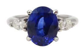 Platinum oval Ceylon sapphire and marquise shape diamond three stone ring