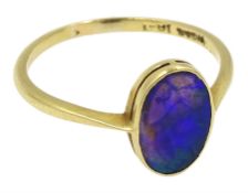 Gold single stone oval black opal ring