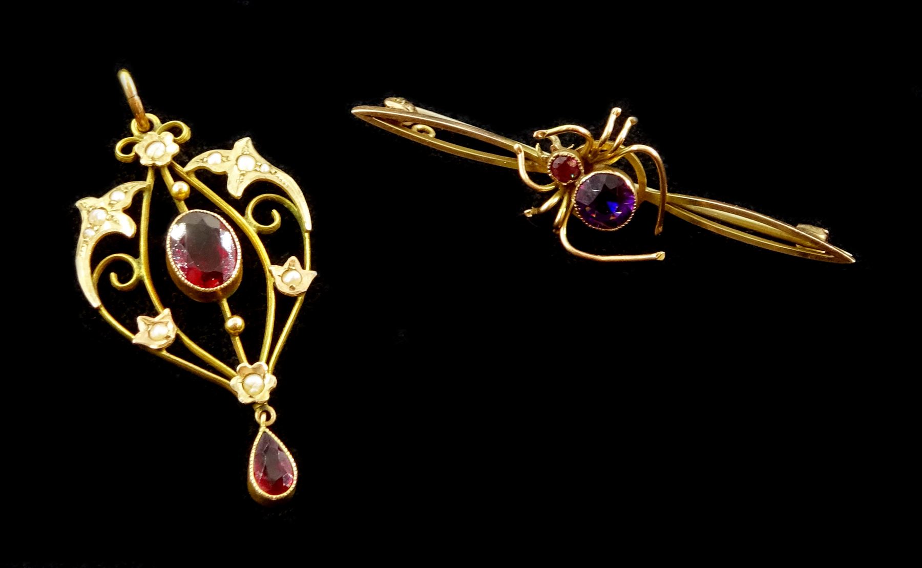 Edwardian gold garnet and seed pearl pendant and an amethyst spider bar brooch