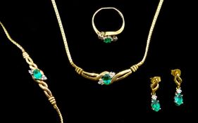 9ct gold diamond and green stone set necklace