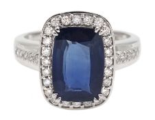 White gold cushion cut sapphire and diamond cluster ring