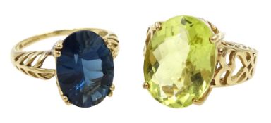 Gold oval peridot ring and a London blue topaz ring