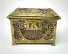 An Arts and Crafts brass and leather casket