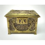 An Arts and Crafts brass and leather casket