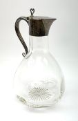 A late Victorian silver mounted claret jug