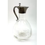 A late Victorian silver mounted claret jug