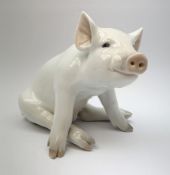 A Royal Copenhagen model of a seated pig