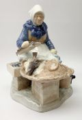 A Royal Copenhagen figure modelled as a fish seller