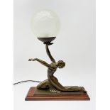 A bronzed Art Deco style table lamp in the form of a dancer