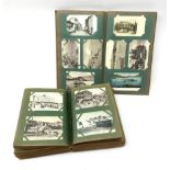 Two early 20th century albums containing over five-hundred and fifty Edwardian and later postcards i