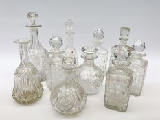 A group of various cut and moulded glass decanters