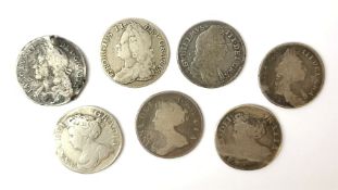 Seven early milled shilling coins