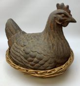 A large cast iron model of a hen