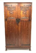 Shapland and Petter of Barnstaple - Arts & Craft style oak heavily carved wardrobe