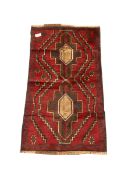 Baluchi red and blue ground rug