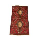 Baluchi red and blue ground rug