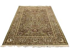 Persian design green ground carpet