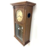 Early 20th century Arts and Crafts oak cased wall clock