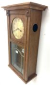 Early 20th century Arts and Crafts oak cased wall clock