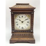 Early 20th century walnut cased mantel timepiece clock